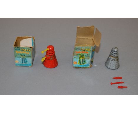 Two Marx Doctor Who and the Daleks Rolykins: first is silver with gold bands (worn) and red eye and arms; second is red with 
