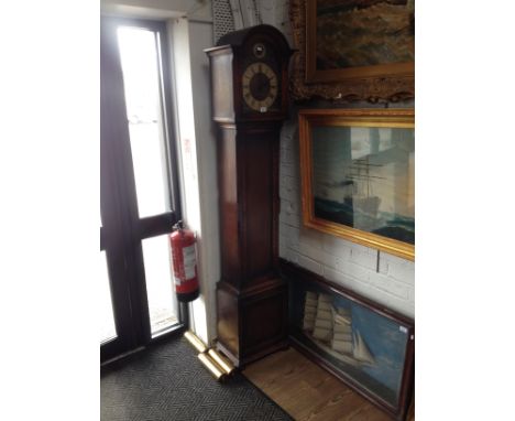 An Edwardian oak cased musical longcase clock with westmister whittington and st. michael chimes. 