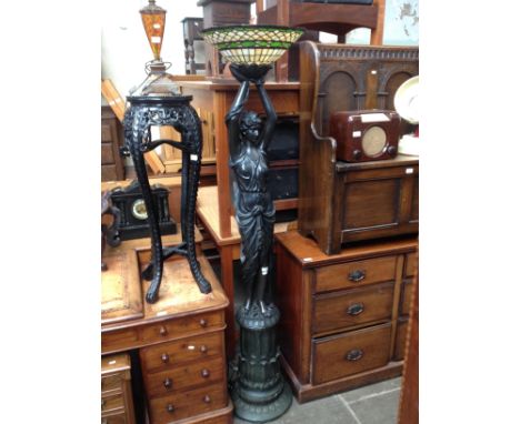 A large figural lamp with Tiffany style shade, height 188.5cm, together with a table lamp. Construction- lamp base is made fr