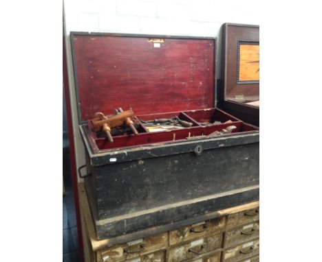 An antique joiner's toolbox with fitted interior containing a number of vintage woodworking tools, planes etc.