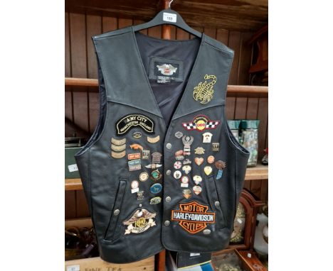 A gents leather Harley Davidson waistcoat, Large size, with 6 various Harley Davidson and motorcycling stick on badges and 39