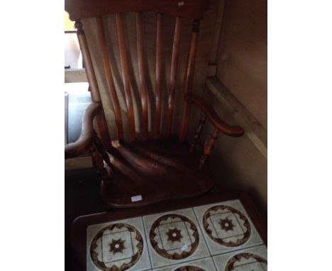 A 19th century beech and elm armchair together with a mid 20th century teak and tile top coffee table. 