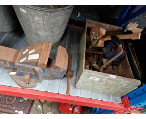 A box of hand tools together with 2 vices, a Record and a Paramo. 