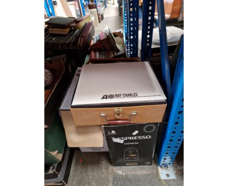 2 boxes of LPs and a small record player and a Ray Charles CD box set.