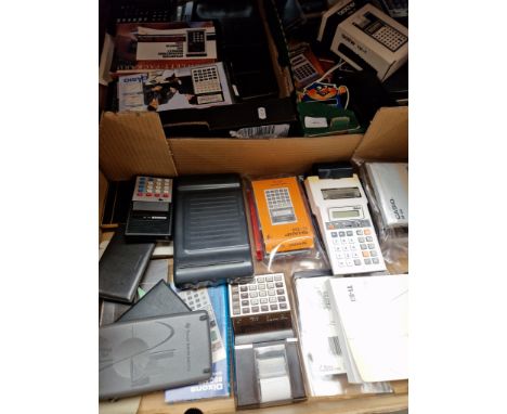 Three boxes of vintage calculators. 