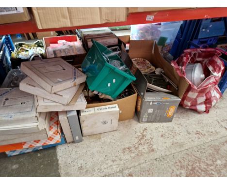 A shelf of mixed items including pots, pans, drinking glasses, collectors plates etc 