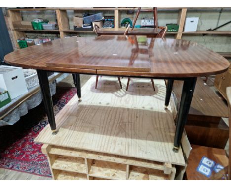 A vintage G Plan 'Librenza' tola teak and ebonised extending dining table, 117cm x 137cm extending to 188cm. 