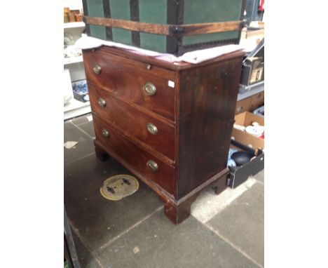 A George III mahogany chest of drawers with brushing slide, hunting scene handles, stood on bracket feet. 