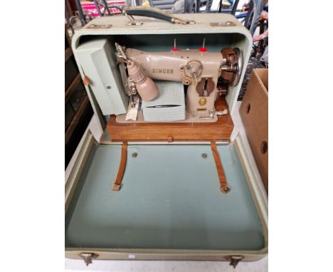A vintage mid 20th century Singer sewing machine, model 216-G, circa 1954 with pedal and accessories 
