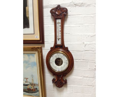 An oak cased banjo barometer/thermometer. 