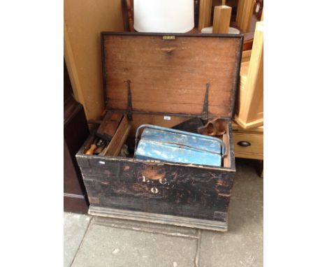 An antique joiner's tool chest containing a number of vintage hand tools, saws etc. 