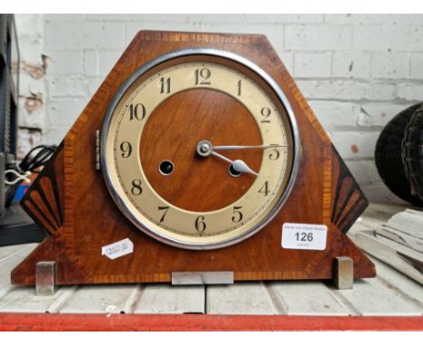 A 1930s Art Deco walnut cased mantle clock, complete with pendulum and key. 