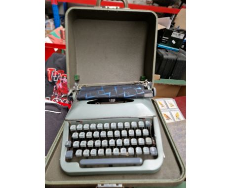 A vintage portable typewriter in case 