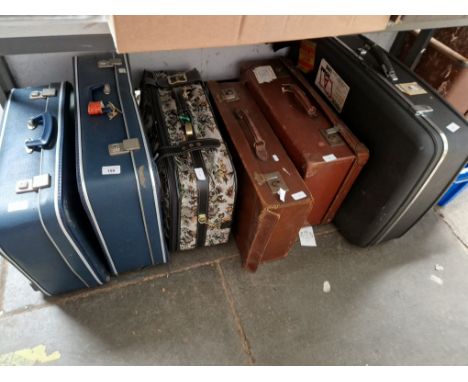 6 suitcases, (2 leather, 1 soft material and 3 hard shell) and a cabin trunk 
