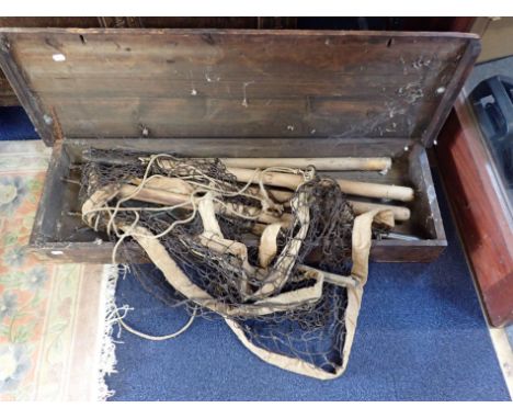 A VINTAGE BADMINTON NET AND POSTS for the garden, in old pine case