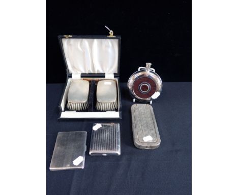 A BOXED SET OF SILVER-BACKED HAIR BRUSHES with a spirit flask, two cigarette cases and a Rolls razor