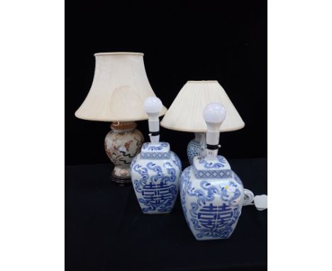 A PAIR OF TABLE LAMPS OF CHINESE VASE FORM with blue decoration, and two other ceramic table lamps (4)