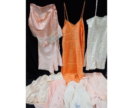 A COLLECTION OF 1930S AND LATER LADIES' UNDERWEAR including silk knickers, and slips, contained in a small vintage case