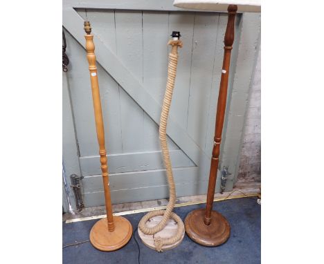 A COILED ROPE STANDARD LAMP and two conventional wooden standard lamps (3)