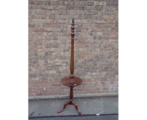 A 1920S MAHOGANY STANDARD LAMP with baluster stem, dished table top, and tripod legs