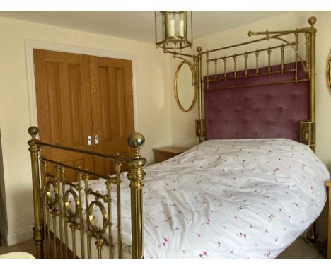 A VICTORIAN HALF TESTER BRASS BED with triple ring foot, curtain brackets and later mesh/spring and upholstered head panel 14