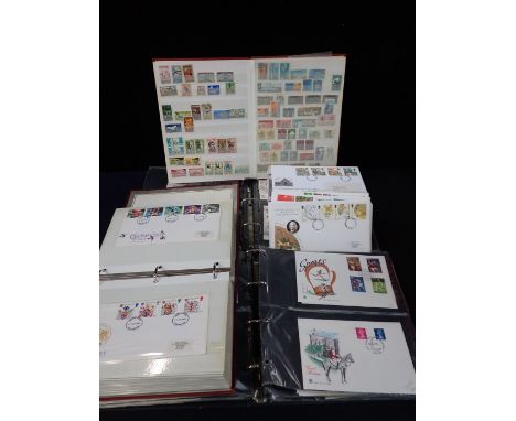 A COLLECTION OF FIRST DAY COVERS and stamps in a stock book