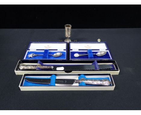 TWO SILVER COMMEMORATIVE SPOONS silver-handled cake and bread knives, and a Chinese white metal footed cup