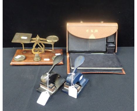 A SET OF POSTAL SCALES, A TRAVELLING WRITING CASE (a/f) and two desk address embossers (4)