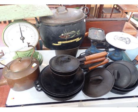 A SET OF CAST-IRON PANS, KITCHEN SCALES a copper kettle, and an iron pan, later painted