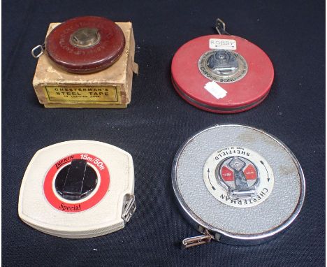 FOUR VINTAGE TAPE MEASURES 