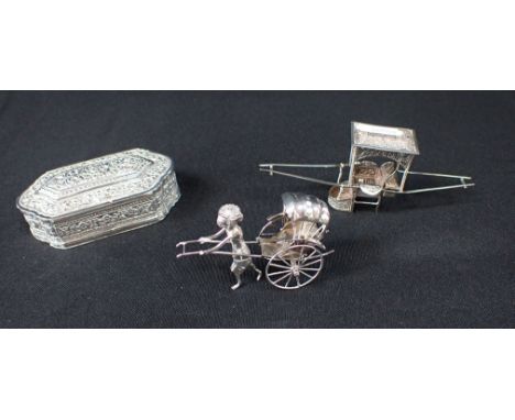 A CHINESE WHITE METAL MODEL OF A RICKSHAW 5cm high, an Eastern filigree white metal model of a sedan chair, 5cm high, and an 