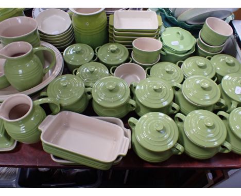 A QUANTITY OF LE CREUSET CERAMIC WARE in green, and similar Kuhn Rikon ware
