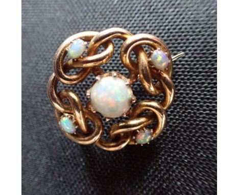 A 15CT YELLOW GOLD AND OPAL KNOT BROOCH 