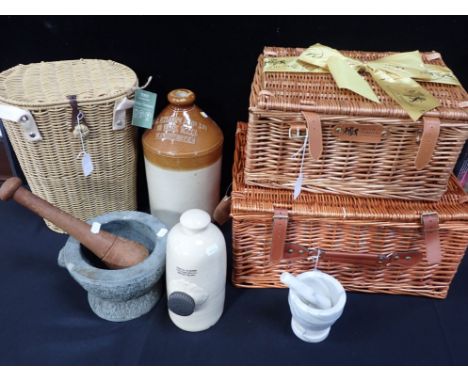 A STONEWARE FLAGON; 'W.H. MILNER &amp; CO...MANCHESTER' a granite mortar with wooden pestle, a smaller marble example, a ston