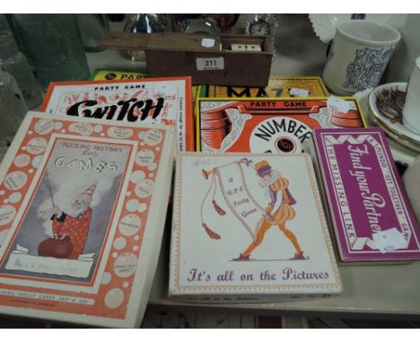 A selection of vintage childrens games and a set of bone and ebony dominoes
