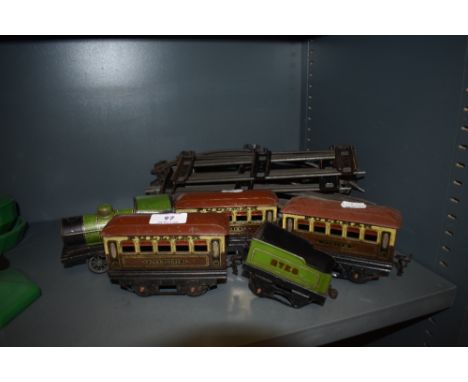 A selection of O gauge train track and carriages.
Condition report:
Locomotive/engine in poor condition with body detached, p