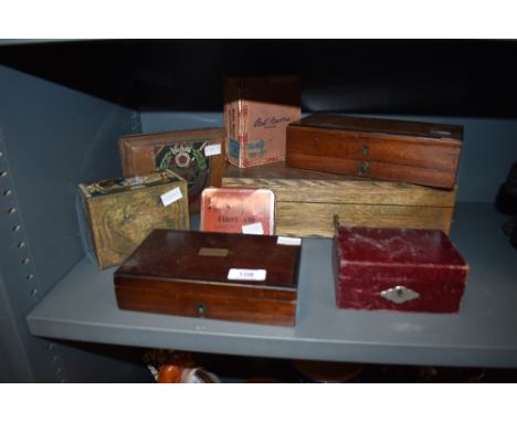 An assortment of vintage and antique tins and wooden boxes also a travelling money box.