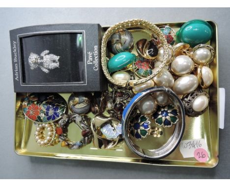 A small selection of costume jewellery including 1980's style enamelled and pearl clip earrings, bangles and brooches