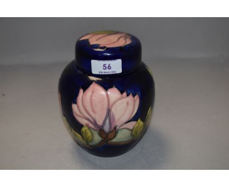 A vintage Moorcroft ginger jar having deep blue ground in the Magnolia design
Good condition, Nominal firing imperfections/sc