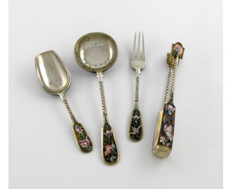 A four-piece Russian silver and enamel serving set, 1896-1908, comprising: a sugar sifting spoon, a pair of sugar tongs, a su