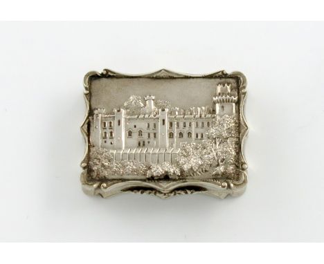 A Victorian silver 'castle-top' vinaigrette, Warwick Castle, by Nathaniel Mills, Birmingham 1849, rectangular form, the hinge