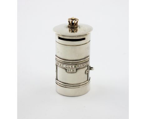 A novelty silver stamp dispenser, by Charles Usher, Birmingham 1922, modelled as a pillar letter box, the pull-off cover with