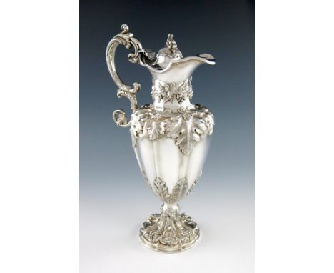 A Victorian silver ewer, by Henry Wilkinson and Co, Sheffield 1851, lobed circular baluster form, embossed vine-leaf decorati