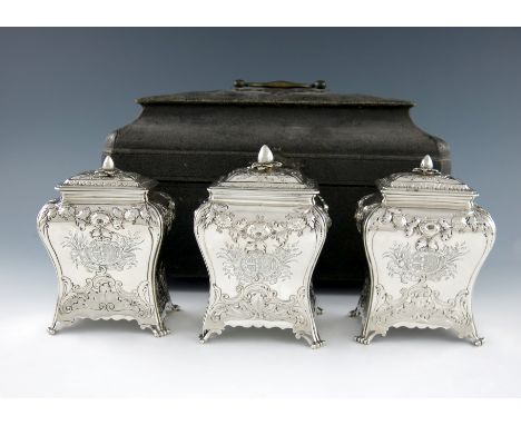 A set of three George II silver tea caddies, by Daniel Smith, London 1759, rectangular bombι form, embossed foliate scroll an