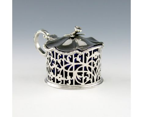 A Victorian silver mustard pot, by John Figg, London 1841, circular form, scroll handle, pierced with foliate scroll decorati