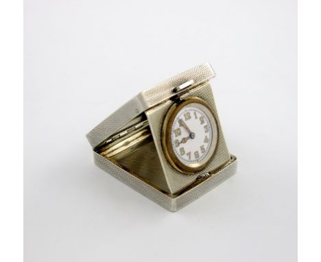 A silver travelling folding clock, by S. P Ora and Co, Birmingham 1940, rectangular form, engine-turned decoration, length cl