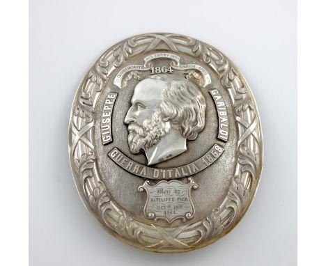 A Victorian silver Garibaldi rowing prize arms badge, by P. Firmin and Son, London 1864, oval form, foliate ribbon and reed b