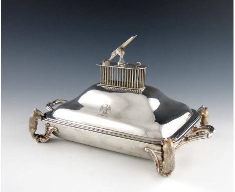 A Victorian electroplated 'mouse-trap' entrιe dish and cover, rectangular form, fluted scroll handles, the pull-off cover wit