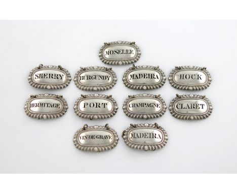 A matched set of eleven George IV/William IV silver wine labels, by Reily and Storer, London 1829/30, oval form, gadroon bord