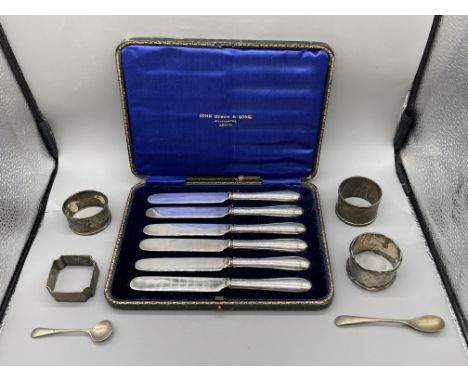 Assorted HM Silver Items to include Silver Handle Knives, Napkin Rings and Spoons. Total weight of solid silver 102gr. 
